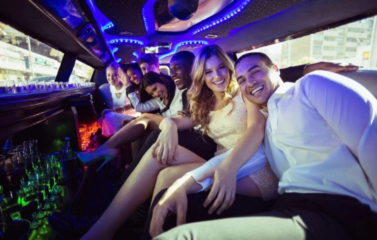 People having fun in a limousine while going to Prom